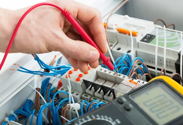 Hands of electrician